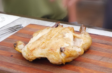 cooked chicken on cutting board